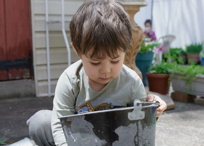 Expressive young boy playing in the back yard