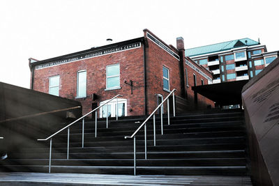 Low angle view of stairs against clear sky