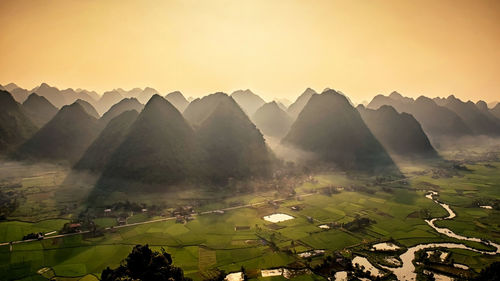 Scenic view of mountains against sky during sunset