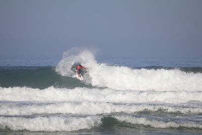 View of waves splashing on sea