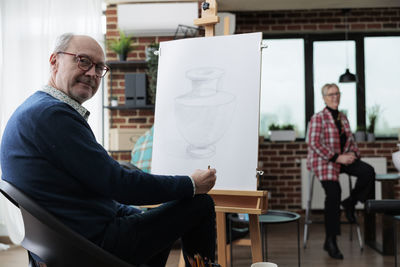 Portrait of painter in studio