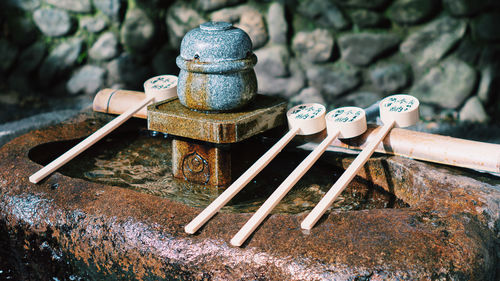 Close-up of old equipment on rock