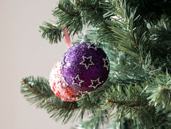 Close-up of christmas decorations hanging on tree