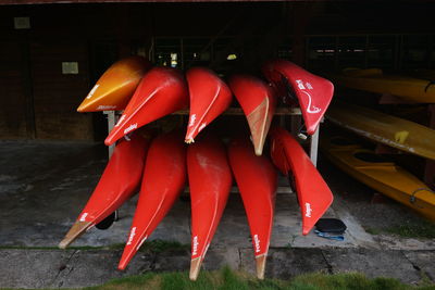 Close-up of red flags hanging against wall in building