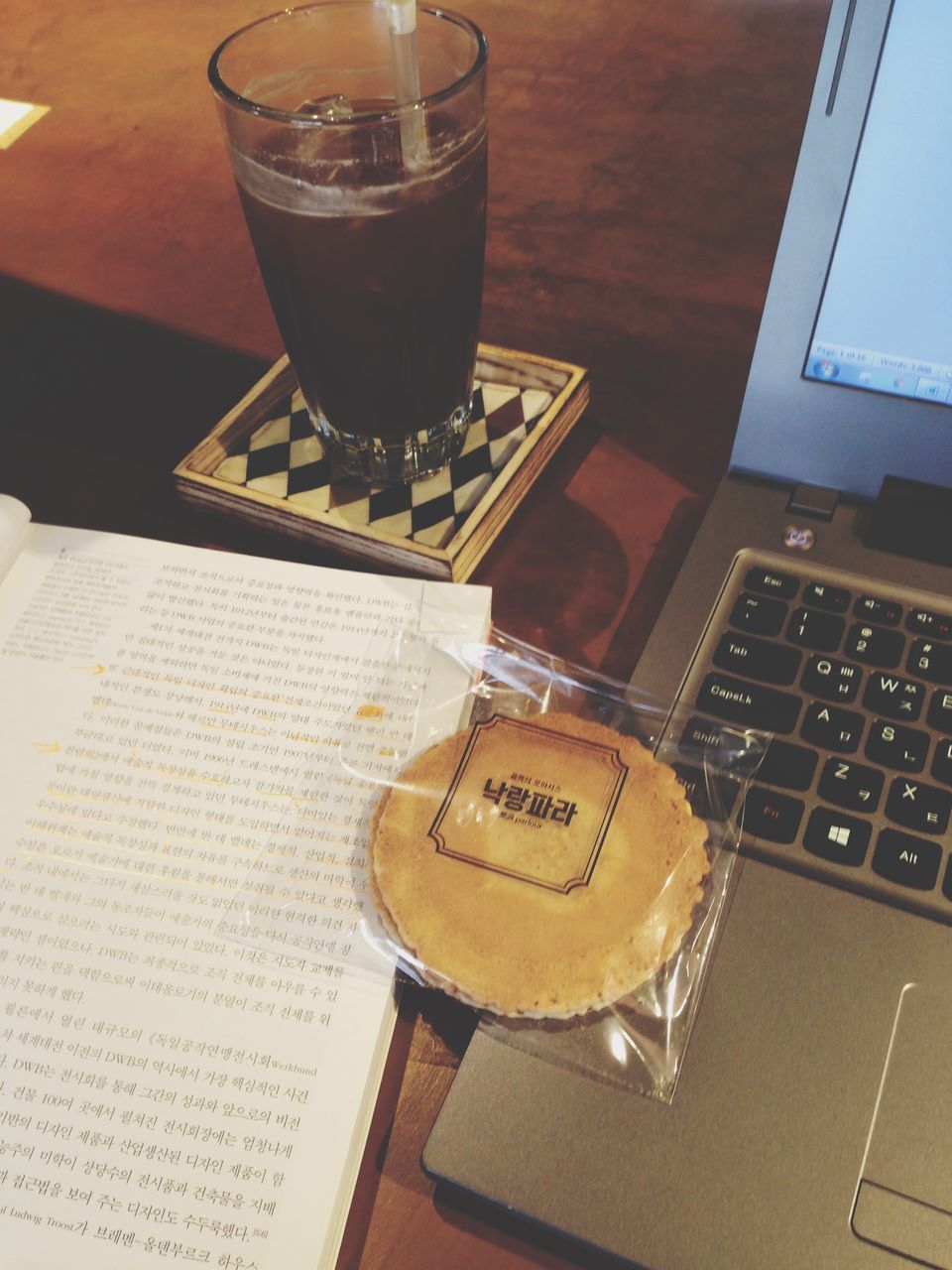 indoors, drink, table, food and drink, refreshment, still life, communication, text, coffee cup, freshness, western script, close-up, coffee - drink, drinking glass, restaurant, high angle view, no people, glass - material, cafe, cup