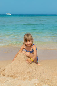 Full length of boy playing at beach