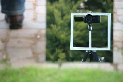 Camera photographing on grass