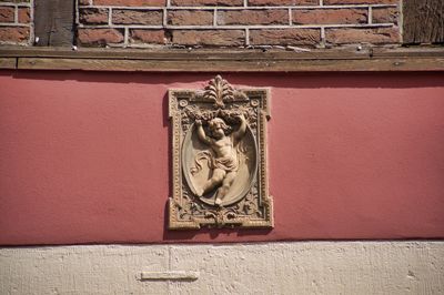 Close-up of sculpture against wall
