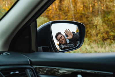 Reflection of car on side-view mirror