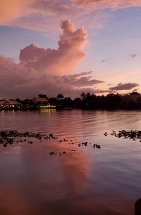 Scenic view of lake against sky during sunset