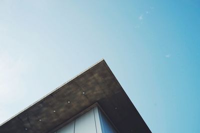 Low angle view of building against clear blue sky