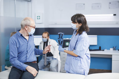 Female doctor working in office