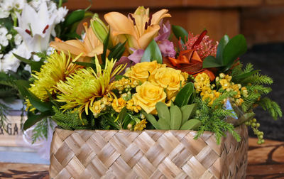 Close-up of yellow flowering plant in basket