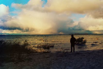 Scenic view of sea against cloudy sky