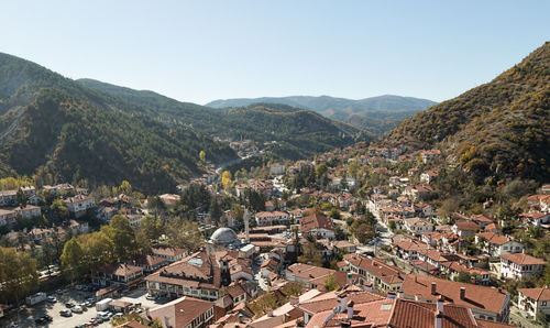 High angle view of trees and mountains against clear sky