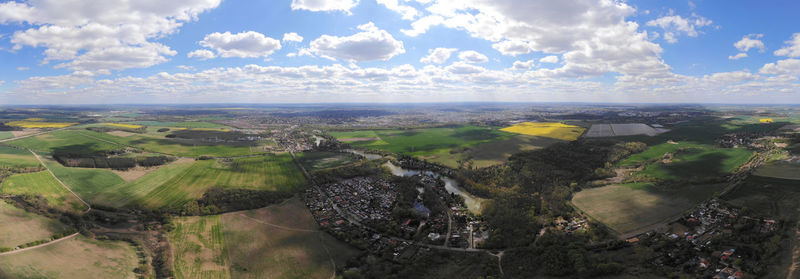 Aerial view of agricultural field against sky