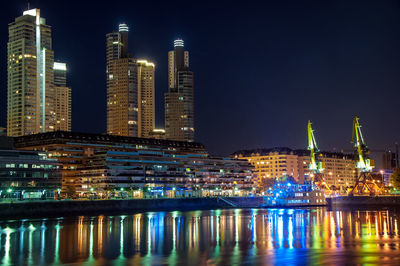 Illuminated buildings in city at night