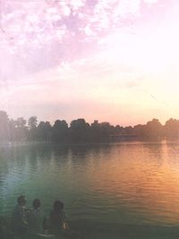 Scenic view of lake at sunset