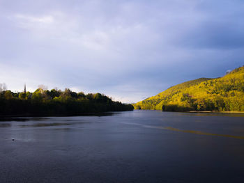 Scenic view of mountain against cloudy sky