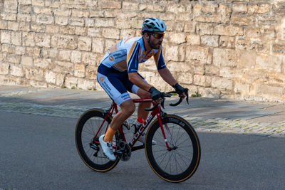 Man riding bicycle on street