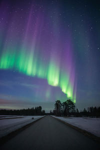 Scenic view of northern lights against sky at night