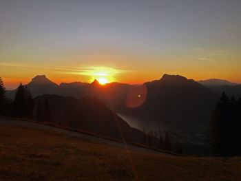 Scenic view of silhouette mountains against sky during sunset