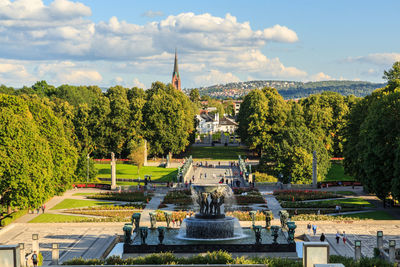 Panoramic view of trees and buildings against sky