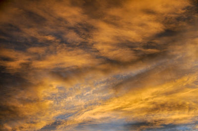 Low angle view of dramatic sky during sunset