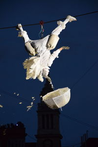 Low angle view of statue against blue sky