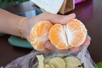 Close-up of hand holding ice cream