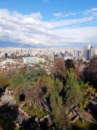 High angle view of buildings in city against sky