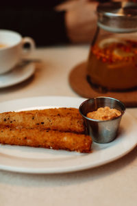 Deep fried cheese sticks with mayonnaise cream. quick and tasty snack