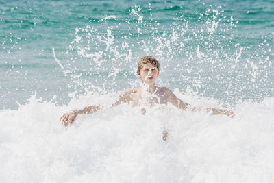 Portrait of man swimming in sea