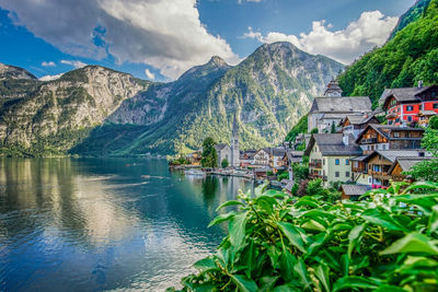Scenic view of lake and mountains against sky