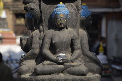Close-up of buddha statue in temple