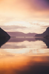 Scenic view of lake against sky during sunset