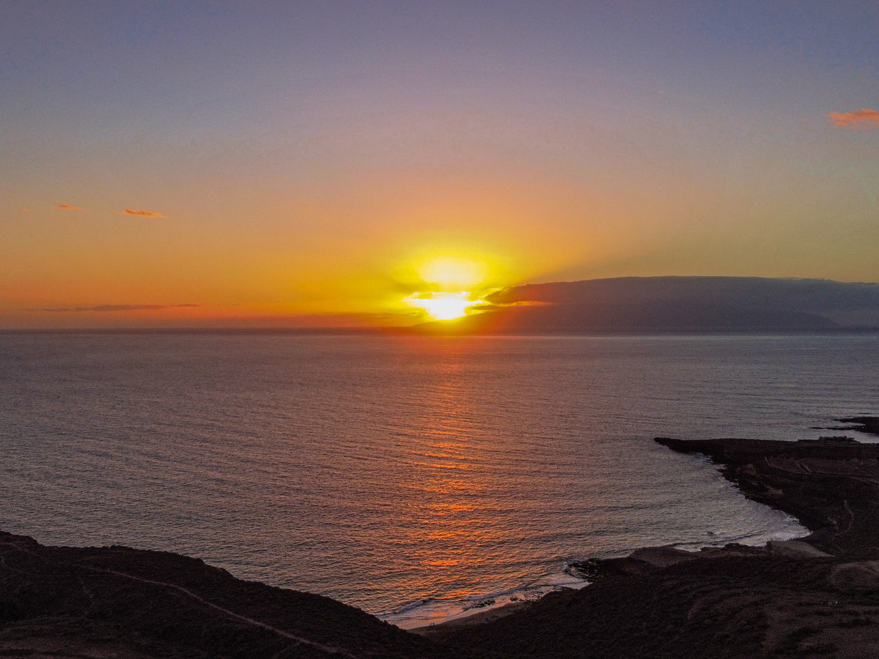 SCENIC VIEW OF SEA AGAINST ORANGE SKY