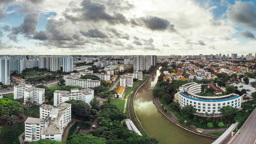 High angle view of modern buildings in city against sky