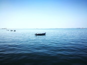 Boat in sea against clear sky