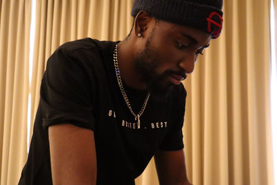 Side view of young man looking away