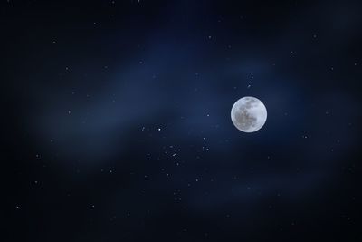 Low angle view of moon against sky at night