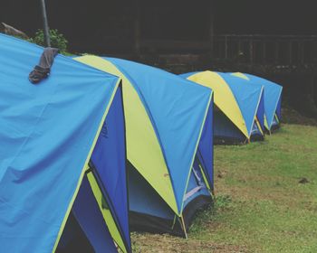 Multi colored umbrella on field