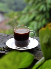 Close-up of coffee cup on table