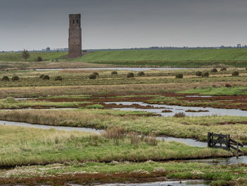 Scenic view of farm against sky