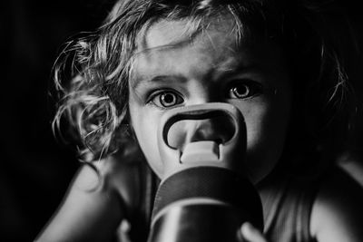 Close-up portrait of girl with water bottle