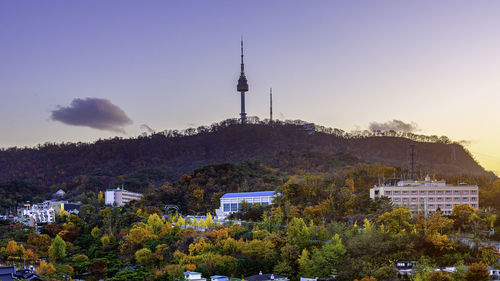 High angle view of trees and buildings against sky