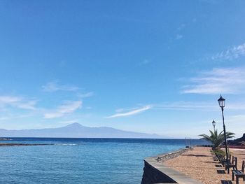 Scenic view of sea against blue sky