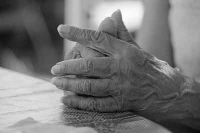 Close-up of man hand on wall