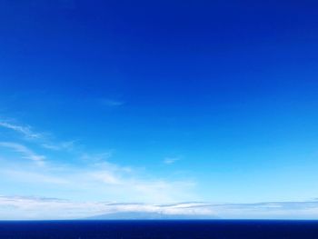 Scenic view of sea against blue sky