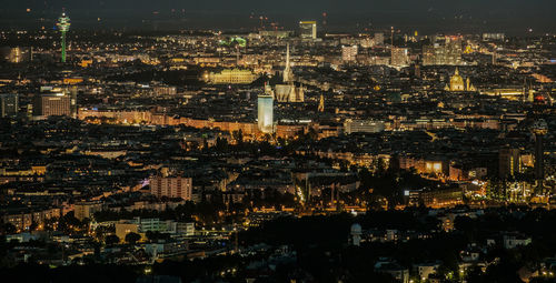 High angle view of illuminated cityscape at night